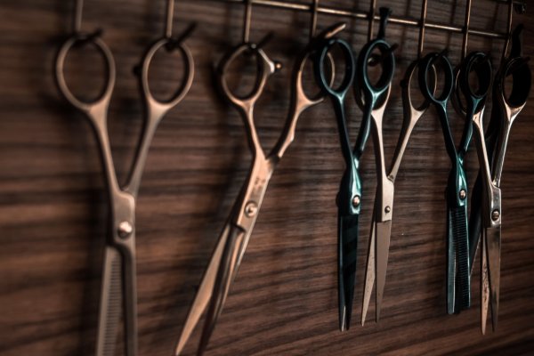 hairdressers scissors hanging from hooks